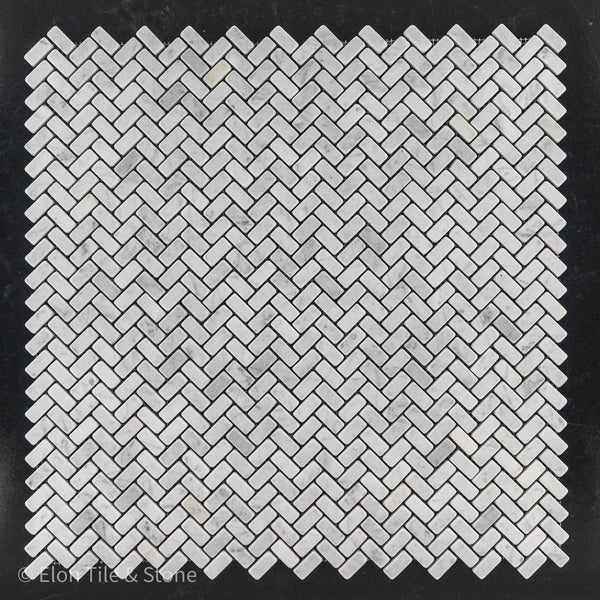 **LIMITED STOCK** Bianco Carrara 5/8" x 1 1/4" Herringbone Mosaic Tumbled